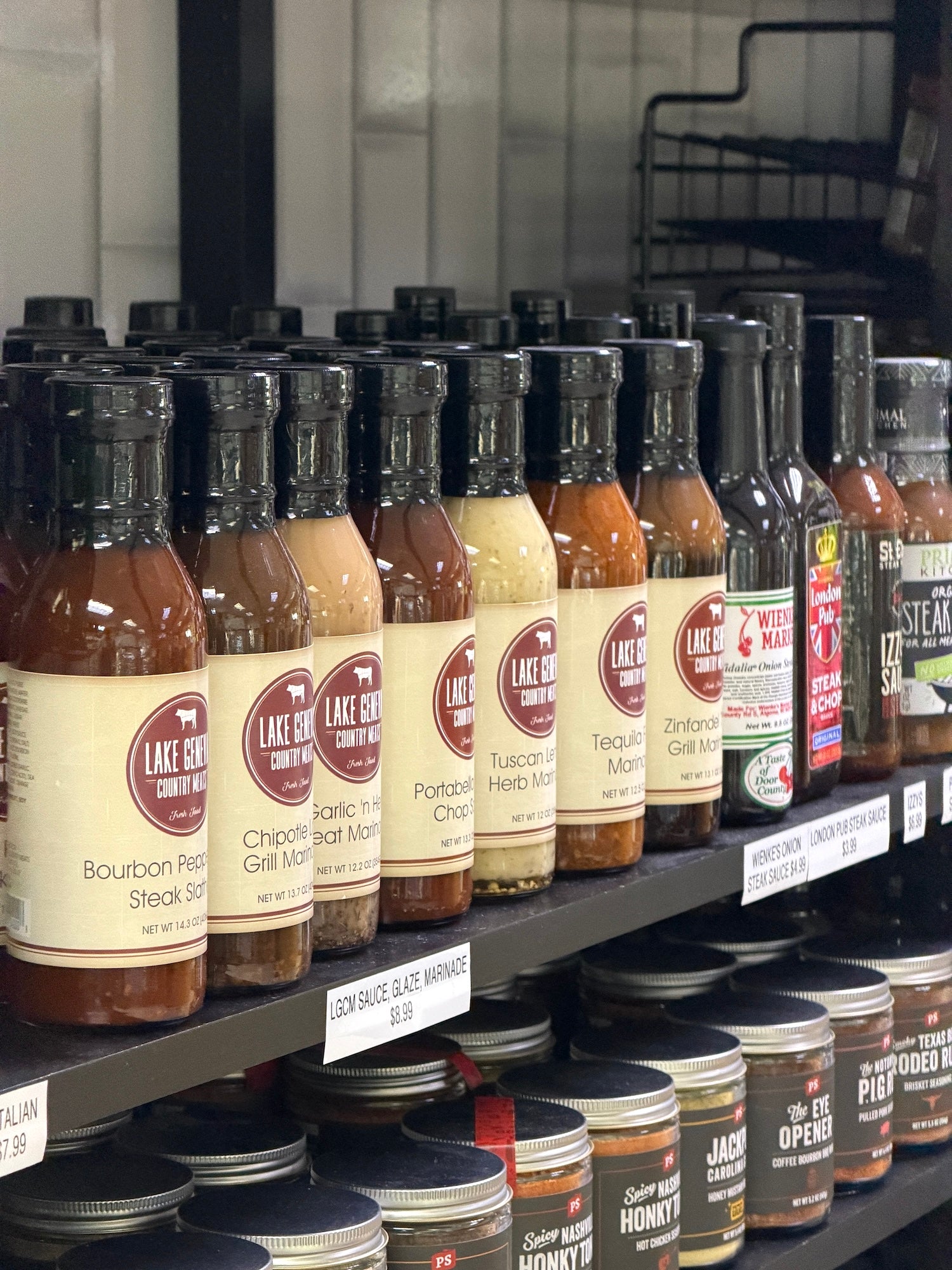 Sauce bottles on a retail store shelving unit