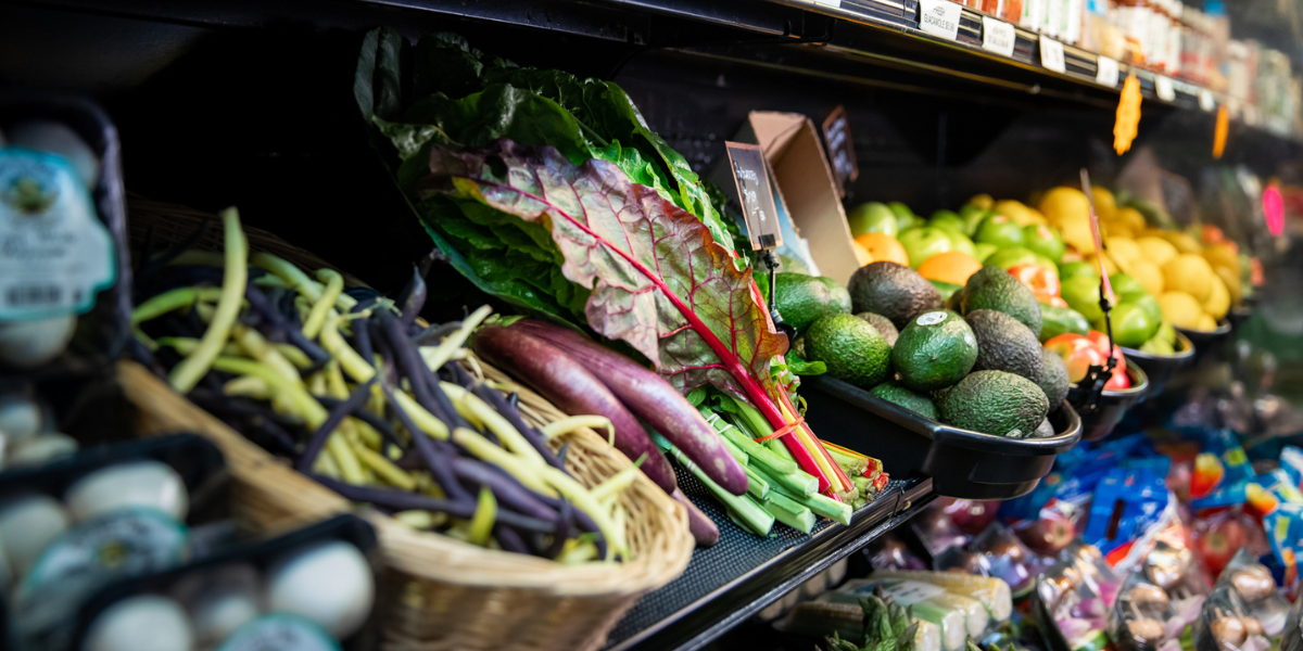 Produce in cooler including chard and avocado