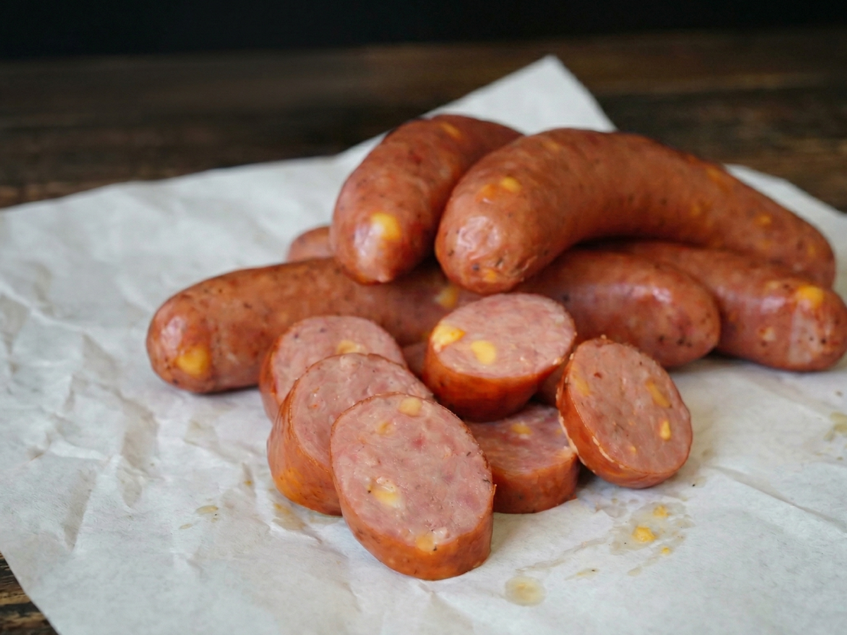Cut open bratwurst with cheese inside
