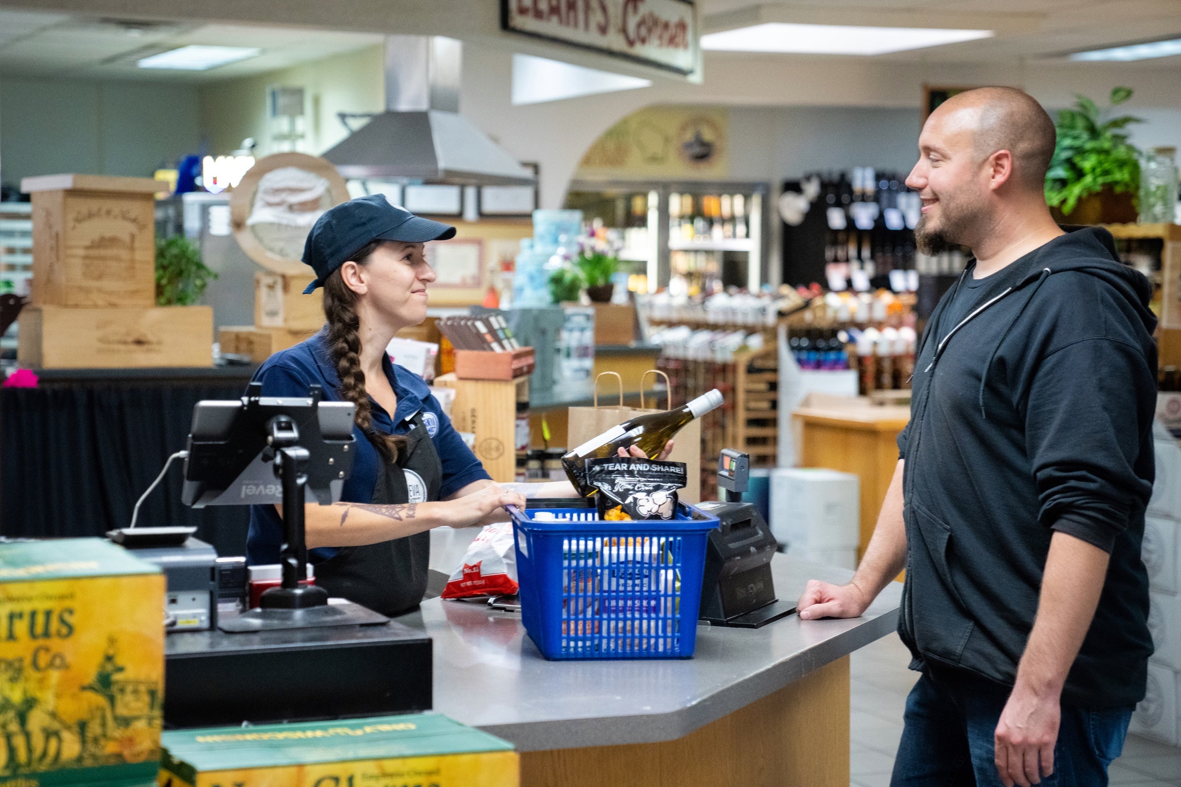 customer checking out at a cash register