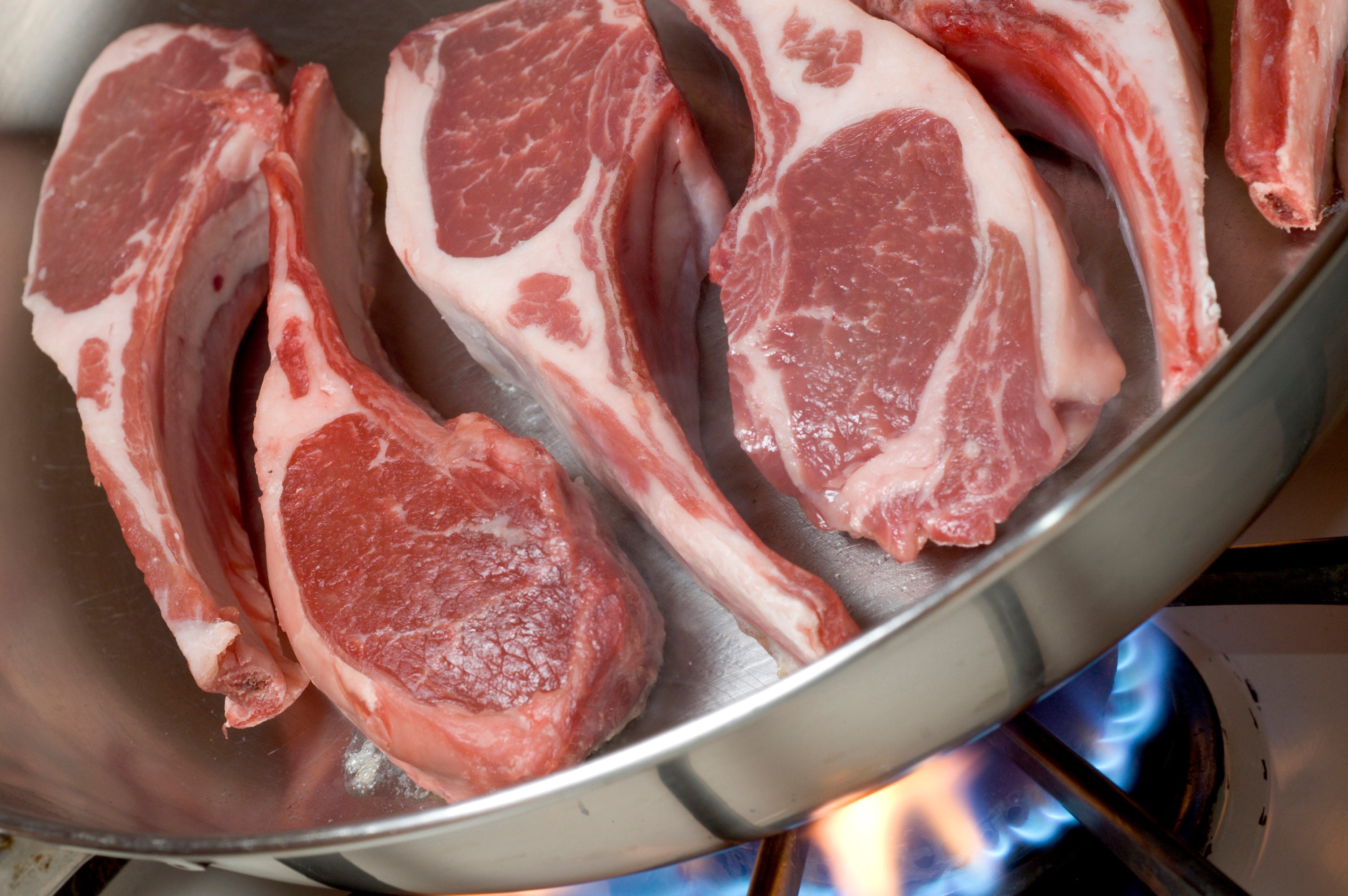 lamb chops in a frying pan