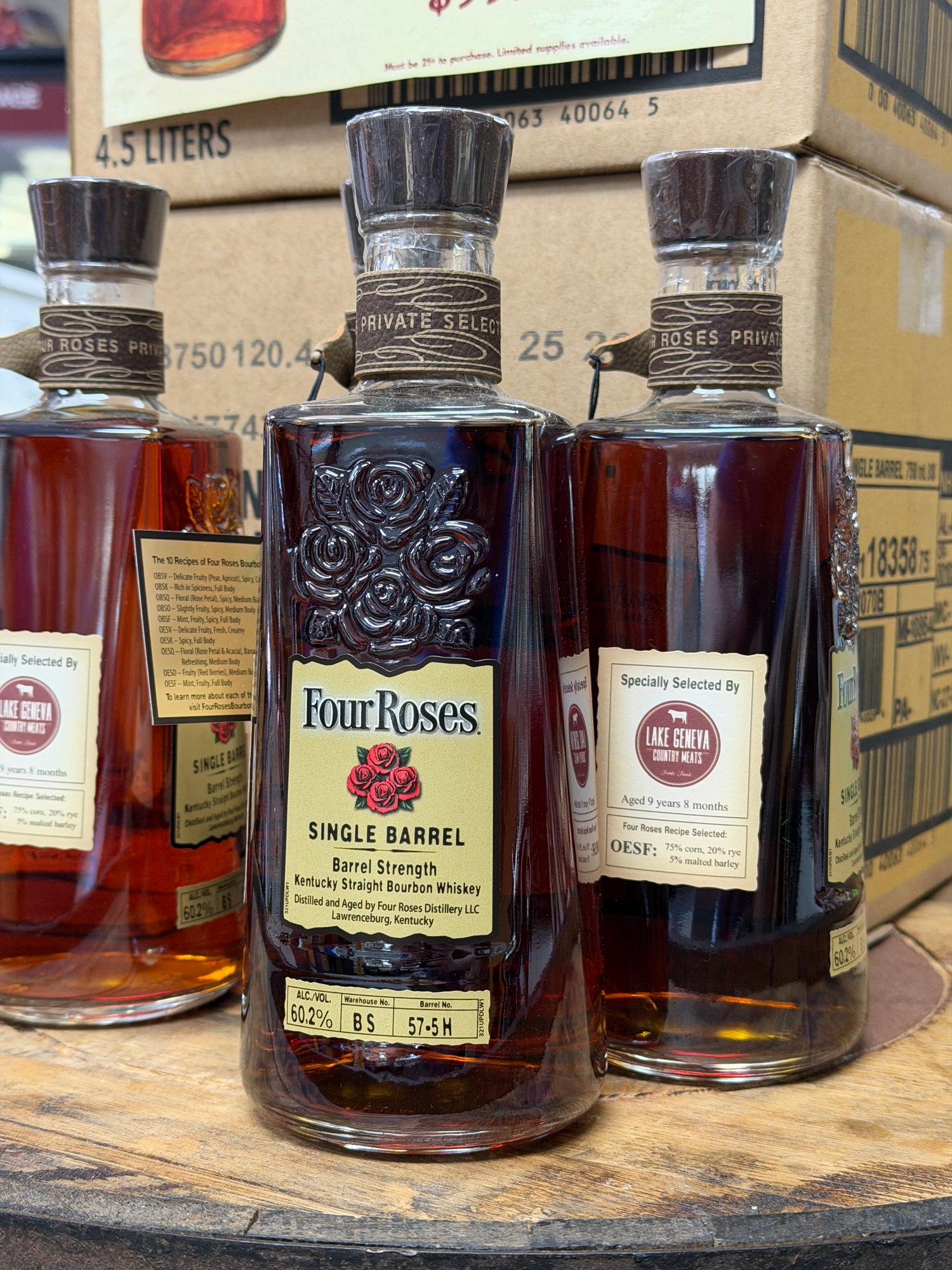 a bottle of bourbon on a whiskey barrel