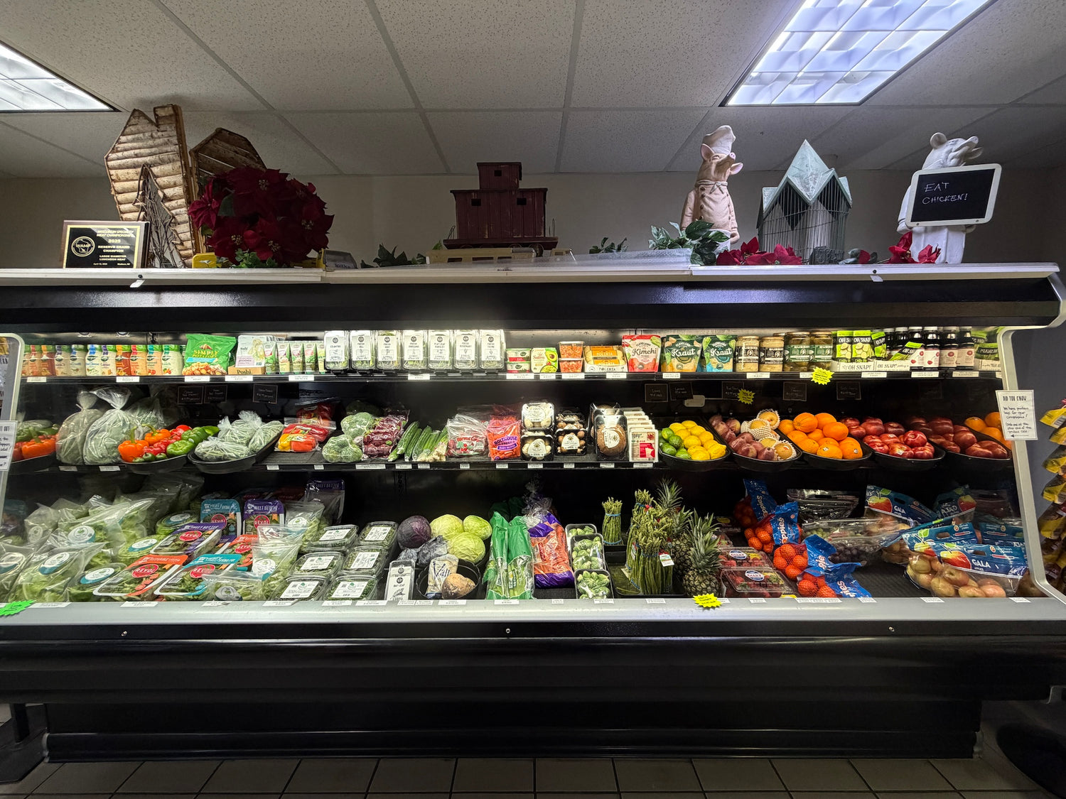 a cooler full of produce items