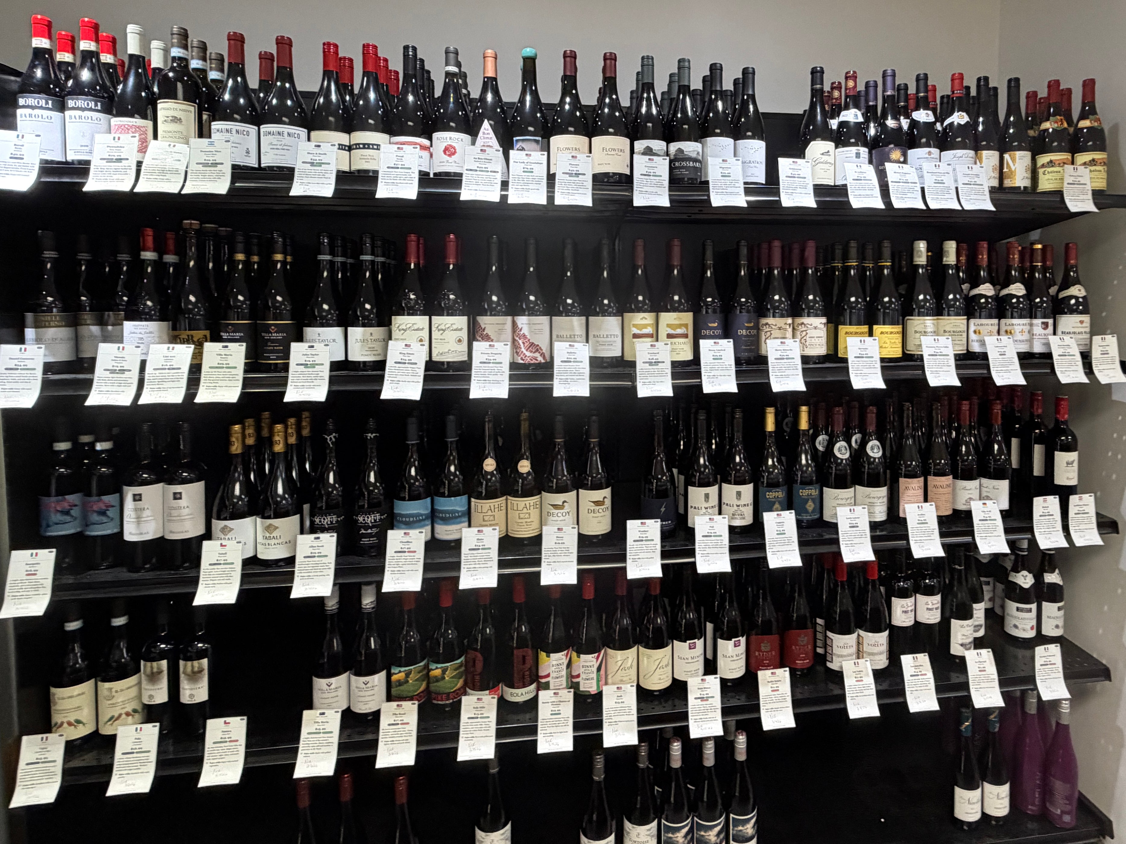 bottles of wine on a shelving unit