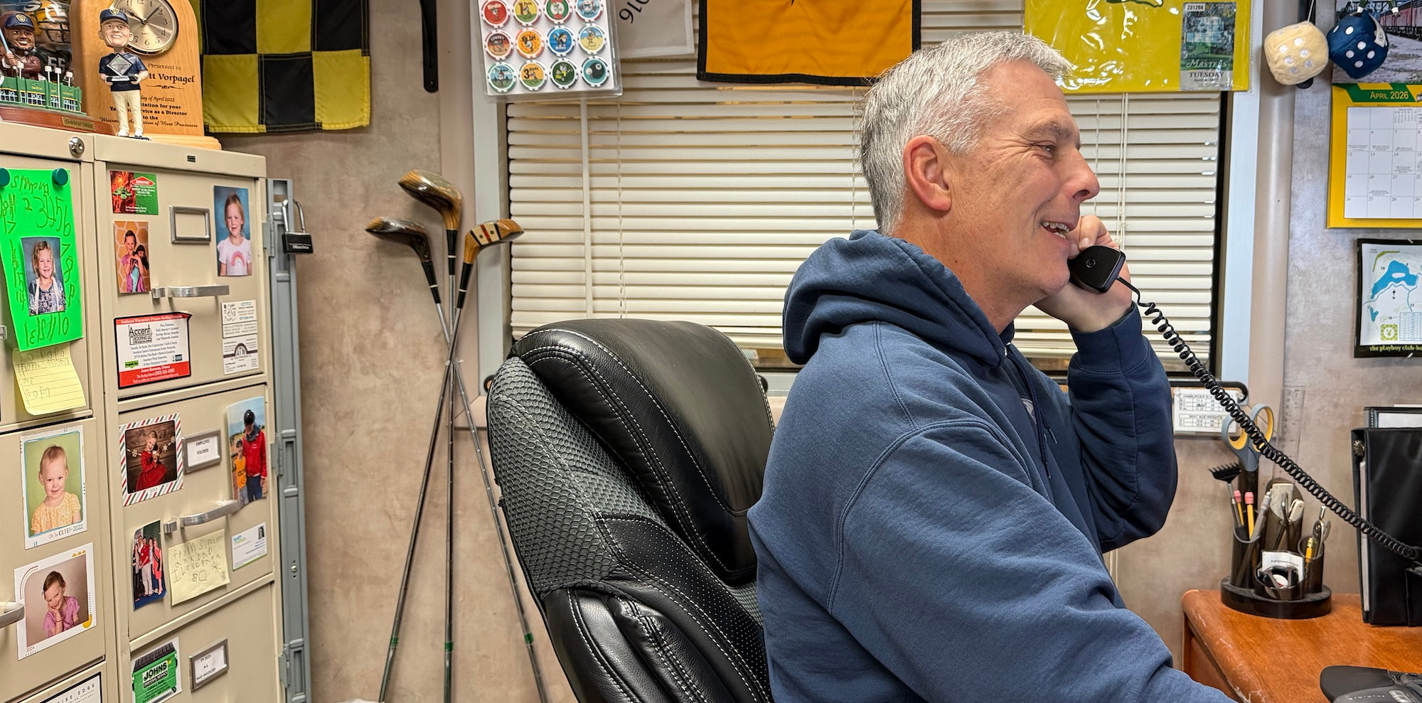 man talking on phone in an office