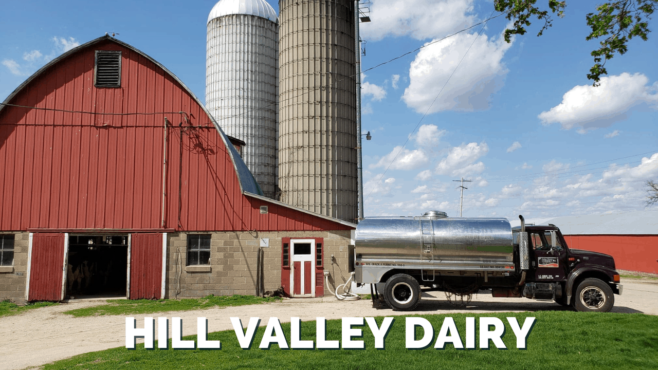 Hill Valley Dairy milk truck in front of red barn