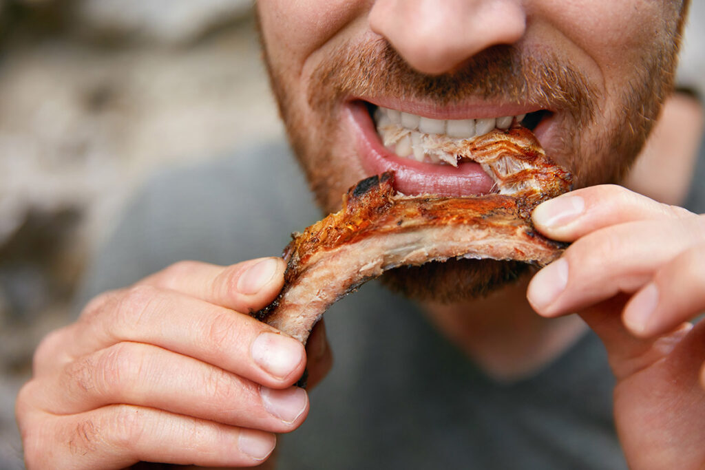 Man Eating Baby Back ribs